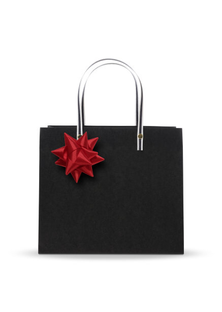 孤立的镜头黑色购物袋与红色蝴蝶结在白色背景图片下载