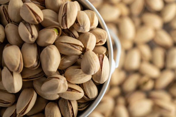 阿月浑子的质地。坚果。绿色新鲜的开心果作为质地。图片下载