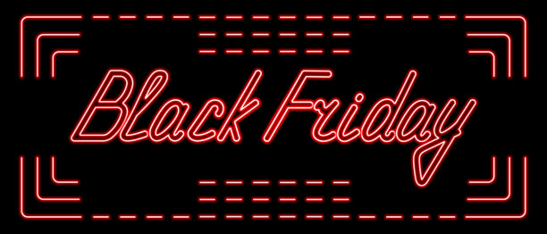 “黑色星期五”。黑色背景上霓虹灯的红色铭文。销售和折扣的标志。图片下载