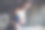 近距离的图片黑发女性在耳机使用智能手机为训练检查播放列表的歌曲，运动员准备训练搜索手机播放器和歌曲使用声音配件图片下载