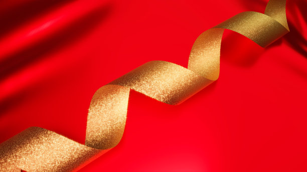 华丽的红布和金色丝带环绕。背景材料。(蹩脚的织物)图片下载