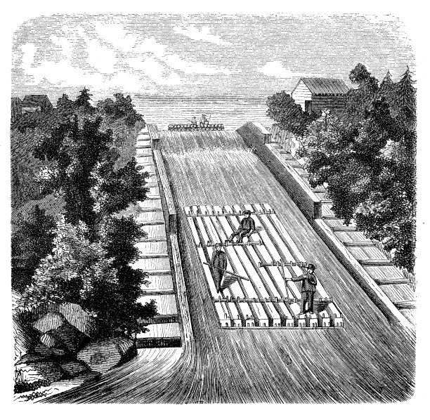 工人们用组装好的木筏通过控制运河水流的闸门。图片下载