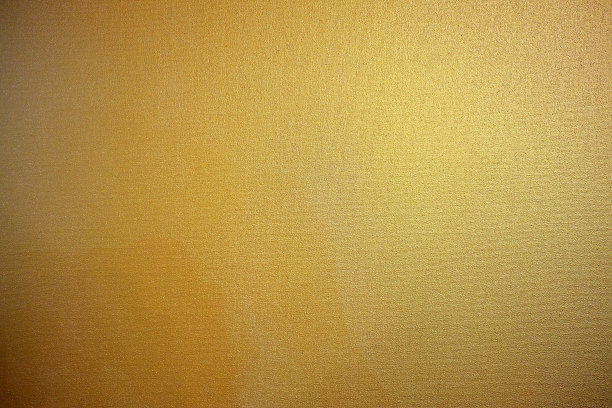 金色油画在画布上的纹理背景。图片下载