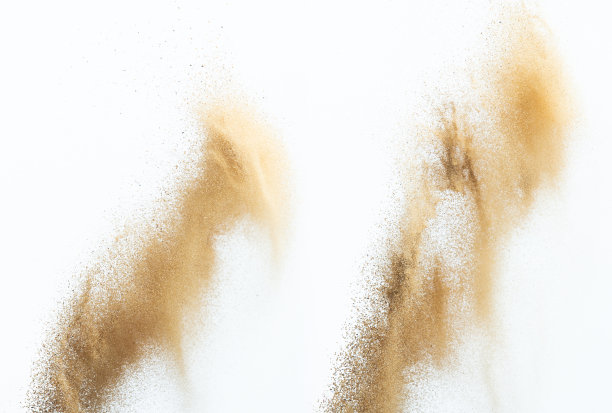 飞沙爆炸，金沙波爆炸。抽象的沙云飞。黄色的彩色沙子在空气中飞溅。隔离高速快门，抛出定格动作图片下载