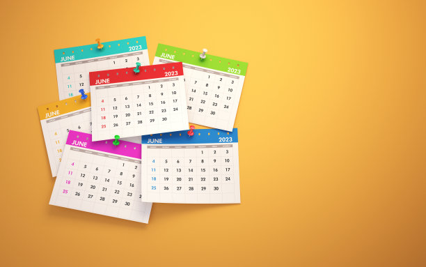 黄色墙上的彩色日历，彩色图钉图片下载