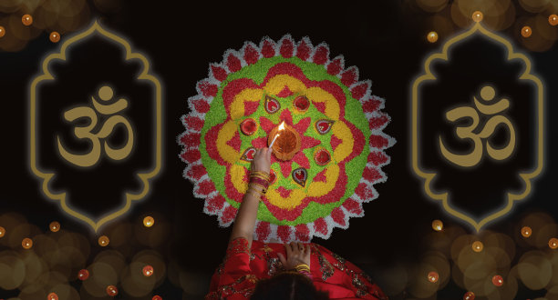 在排灯节庆祝活动中点燃传统的diya灯图片下载