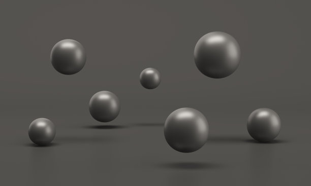 一组孤立在黑色背景上的黑色球体图片下载