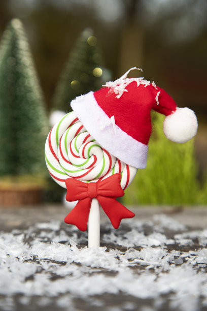 带圣诞老人帽子的棒棒糖图片下载