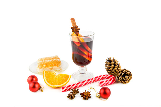 热葡萄酒、蜂蜜和白色的圣诞装饰图片下载
