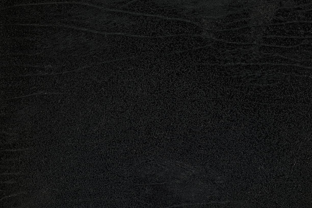 老黑垃圾皮革纹理背景。图片下载