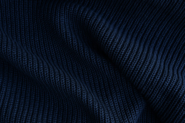 黑色针织面料质地背景。抽象现代针织纹理黑色色彩图片下载