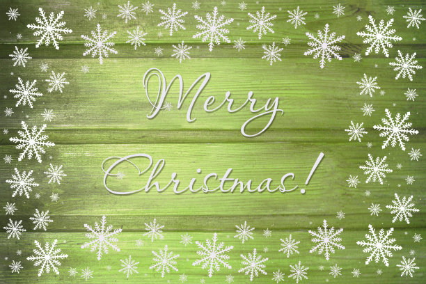 冬季木绿黄色自然背景与雪花环绕。油漆木水平板的纹理。圣诞贺卡快乐。图片下载