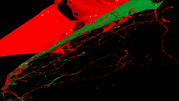 混合红绿色液体飞溅，漩涡和波浪与分散的水滴图片下载