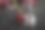 特写一个红色的新鲜樱桃和一个冰块在黑色的桌子背景图片下载