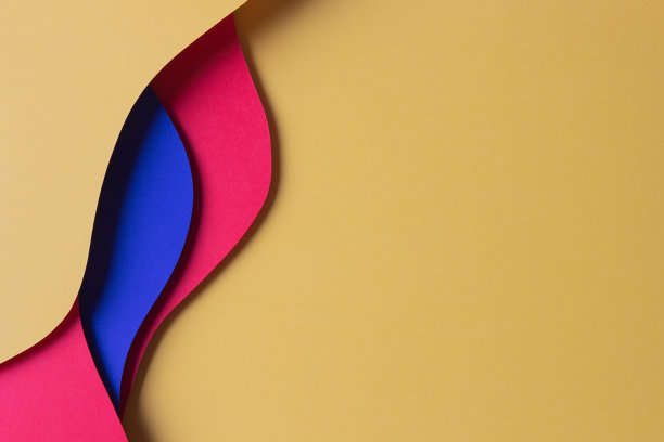 抽象彩纸纹理背景。最小的剪纸风格组成层的几何形状和线的红色，黄色和蓝色。俯视图图片下载