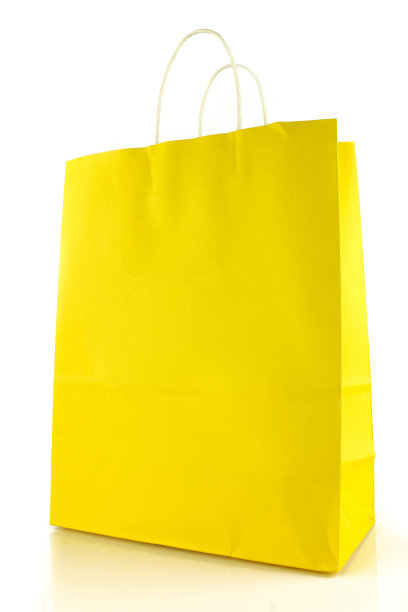 白色背景上的黄色空白纸袋。购物图片下载