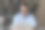 面带微笑的年轻男员工在办公桌前使用电脑打字文件图片下载