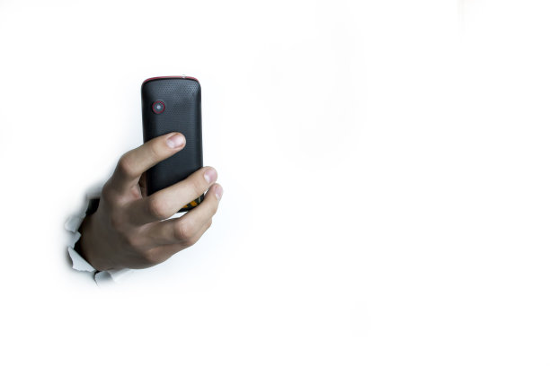 白色背景上的按键式手机。图片下载