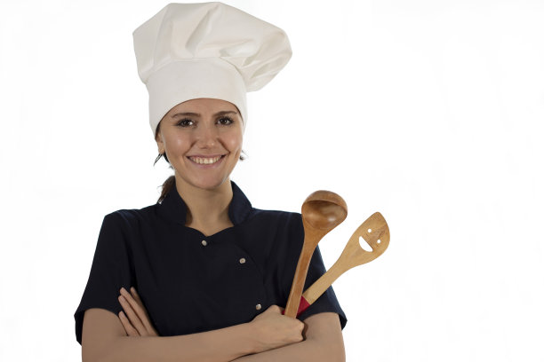 女厨师在餐厅厨房准备食物图片下载