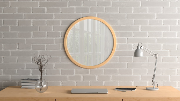 木制圆形海报框架模拟在家庭工作室工作空间的砖墙上。前视图。图片下载