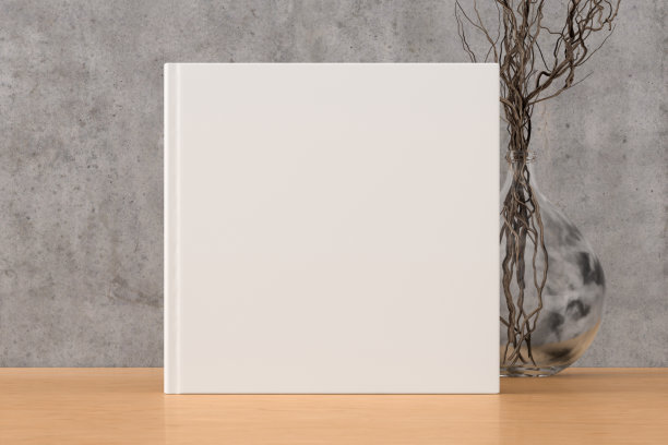 方形书封面模拟站在木桌与混凝土墙背景。图片下载