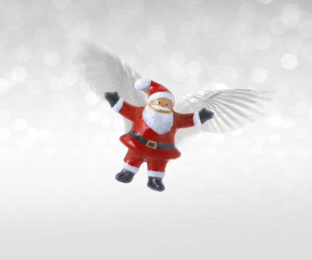 圣诞老人陶瓷娃娃带着翅膀飞翔图片下载