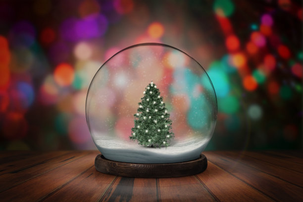 圣诞节的背景是一个雪球。雪球与圣诞节的雪球与暗散景背景。图片下载