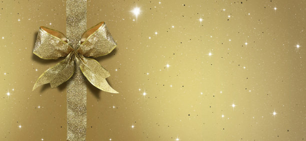 金色缎带蝴蝶结在金色背景图片下载