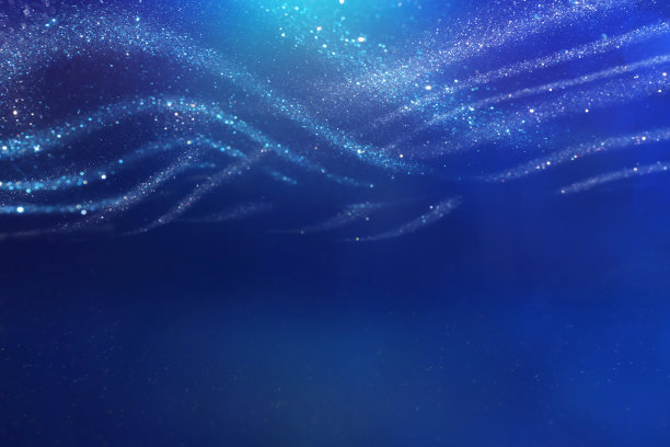背景抽象的蓝色和银色闪烁的灯光。散焦图片下载