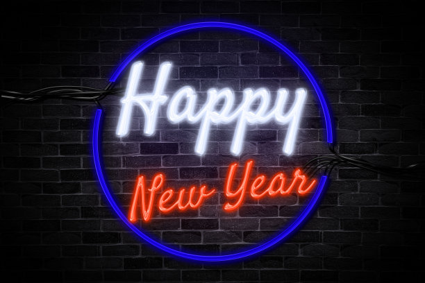 新年快乐霓虹灯横幅，光招牌符号在砖墙背景。图片下载