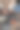 一个女孩坐在地板上喝茶的特写照片图片下载