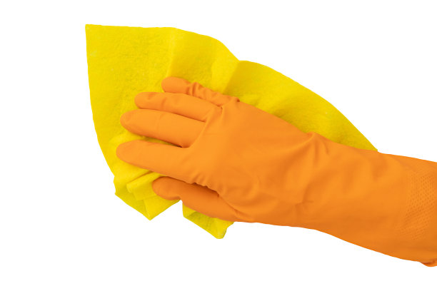 手戴橡胶手套，手持清洁抹布图片下载