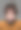 严肃的蓬头垢面的小男孩看着灰色背景上的相机图片下载