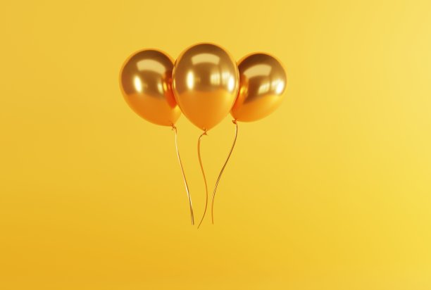 浅色背景上的金色气球。图片下载