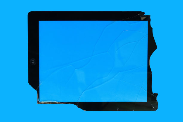 破碎的屏幕平板隔离在蓝色背景上，破碎的屏幕隔离在蓝色背景上，破碎的玻璃-蓝色背景上的白线，俯视图图片下载