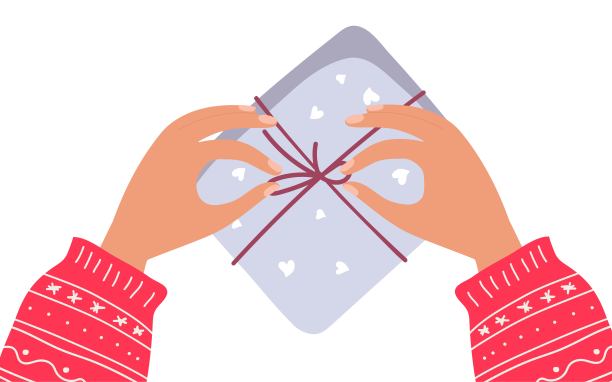 假期准备。包装礼品盒。人手拿温暖的毛衣包装礼物。创造力配件。假日车间。前视图。平面矢量插图孤立在白色背景上图片下载