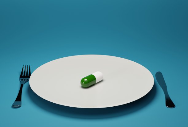 盘子里放着药片，旁边放着刀叉。图片下载