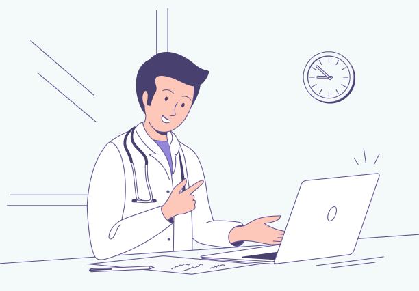 年轻医生坐在诊所办公桌前，用笔记本电脑进行国内治疗在线咨询。图片下载