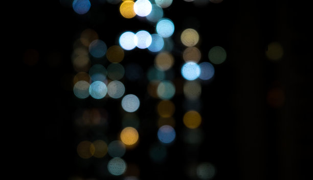 蓝色和橙色失焦灯光抽象城市城市夜晚散景图片下载