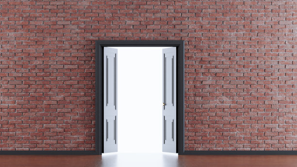 黑色木门在砖墙背景图片下载