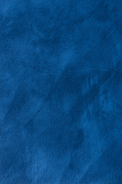 蓝色抽象垃圾纹理表面背景与不均匀的油漆笔画。垂直框架图片下载