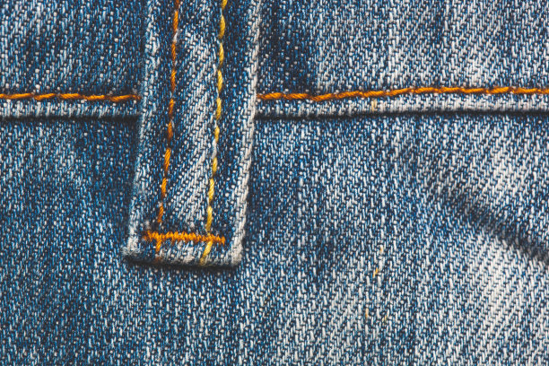 特写纹理线和针脚牛仔裤图片下载