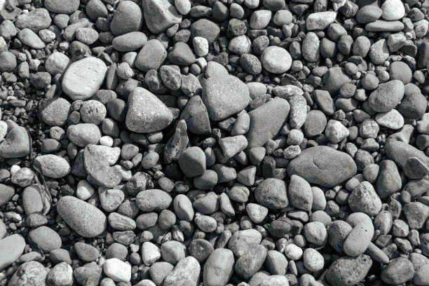 西点灯塔海滩上的卵石黑白抽象背景图片下载