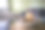 现代当代干净的装饰柳条球在桌子上的餐垫垫在公寓家庭或房子明亮的光线从窗户，沙发沙发图片下载