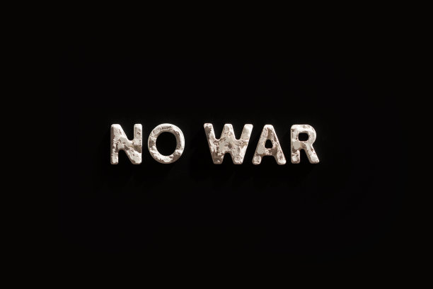 黑色纸背景上的白色纹理大写字母“no war”图片下载