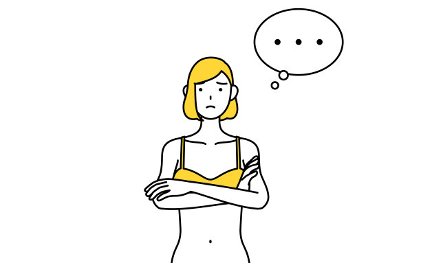 脱毛和美容沙龙图片，一个女人穿着内衣，双臂交叉，思考。图片下载