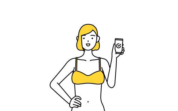 脱毛和美容沙龙图片，一个穿着内衣的女人在工作中使用智能手机。图片下载