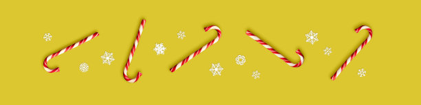 黄色背景的圣诞糖果。与节日糖果和雪花为伴。圣诞背景与复制空间。图片下载