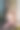 年轻漂亮的美国女子享受运动训练后在窗台上戴着白色大耳机听音乐。青少年日常生活中的音乐观念。垂直图片下载