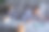 白种男性，穿着睡衣躺在床上，手里拿着药片，身边还有两只姜黄色的猫图片下载